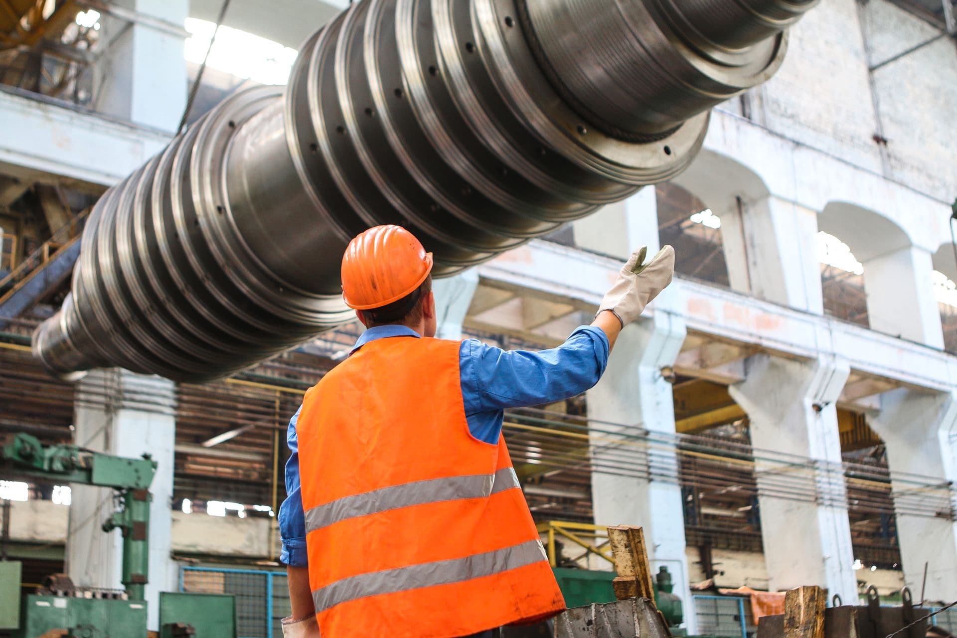 Heavy engineering plant with an overhead crane load